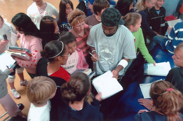 signing autographs